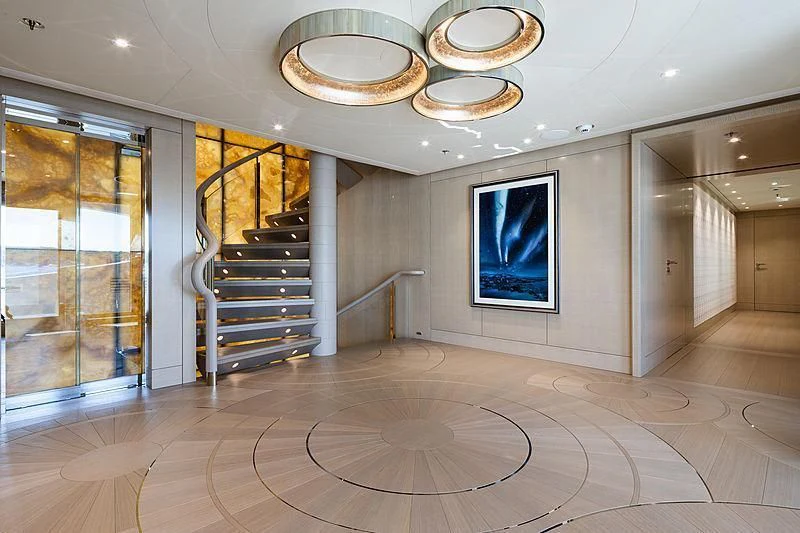 a large empty room with a staircase aboard NENINKA Yacht for Sale