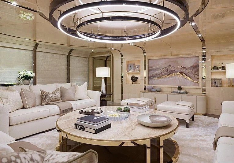 a living room with a large chandelier aboard NENINKA Yacht for Sale