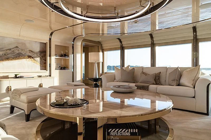 a living room with a couch and a coffee table aboard NENINKA Yacht for Sale
