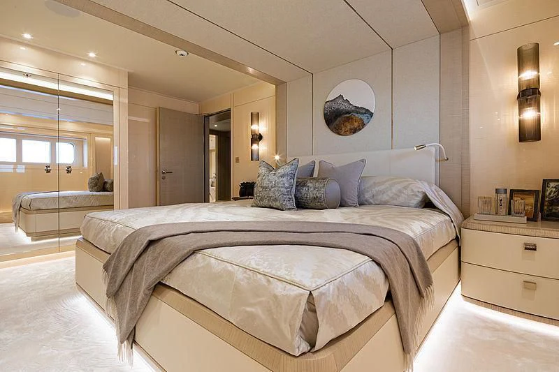 a bed with pillows on it aboard NENINKA Yacht for Sale