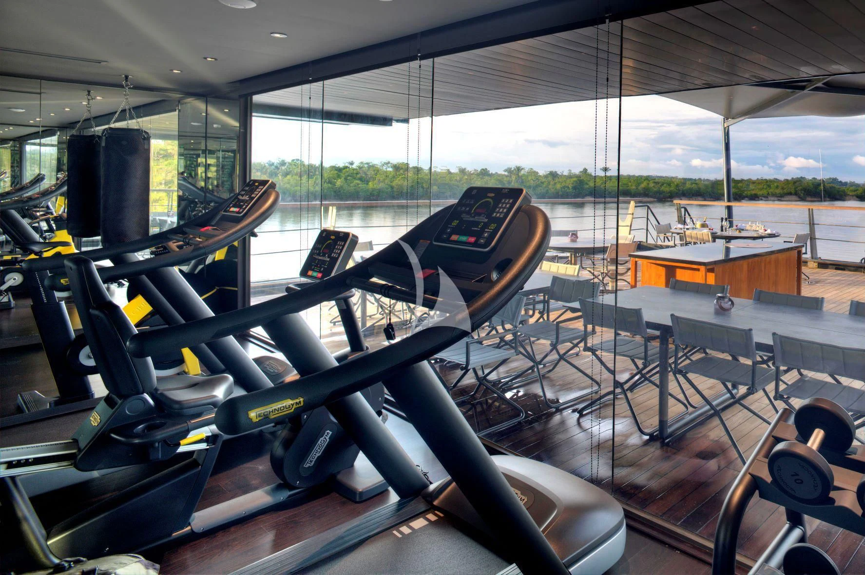 a large gym with large equipment aboard AQUA NERA Yacht for Sale