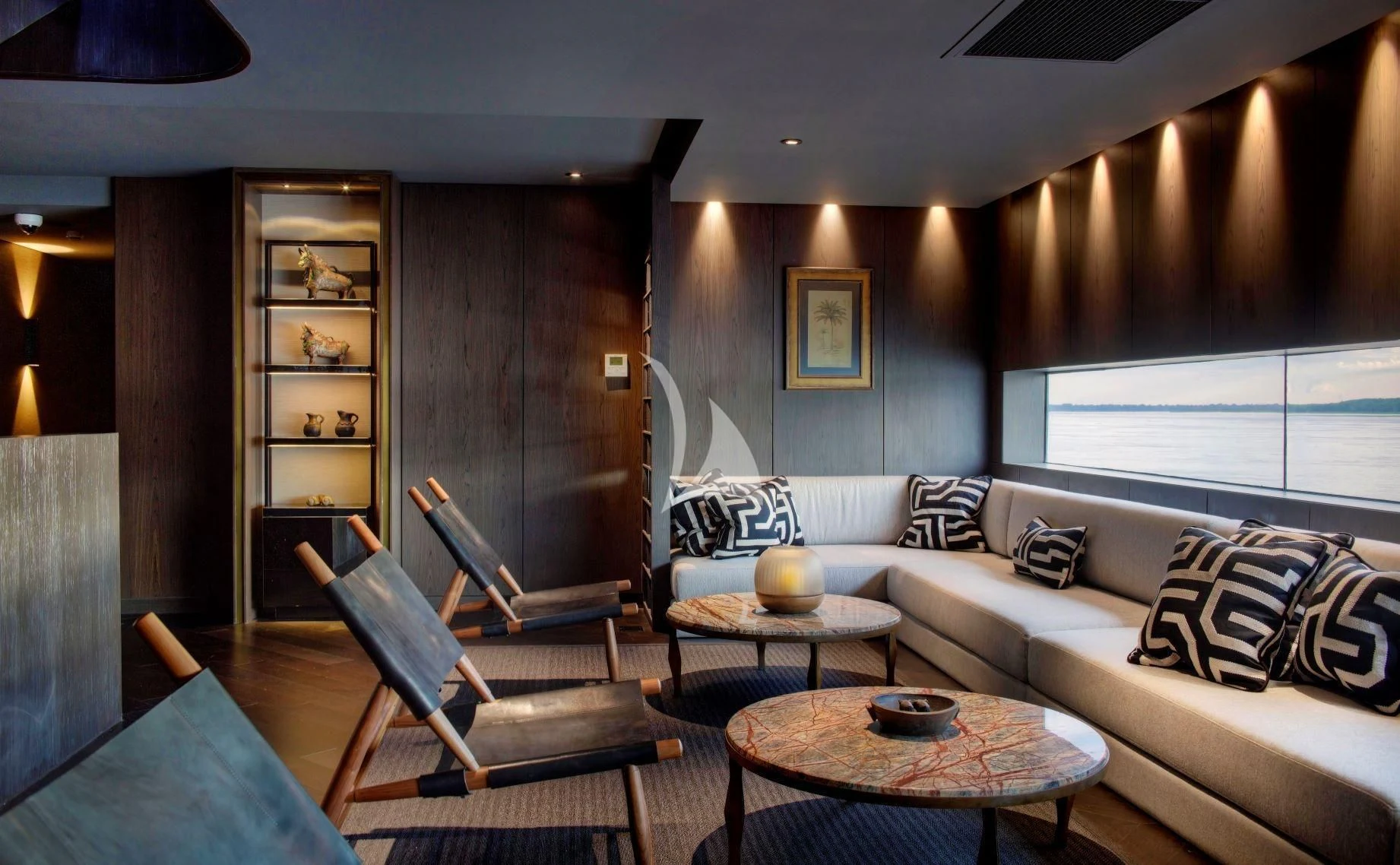 a living room with a wood cabinet aboard AQUA NERA Yacht for Sale