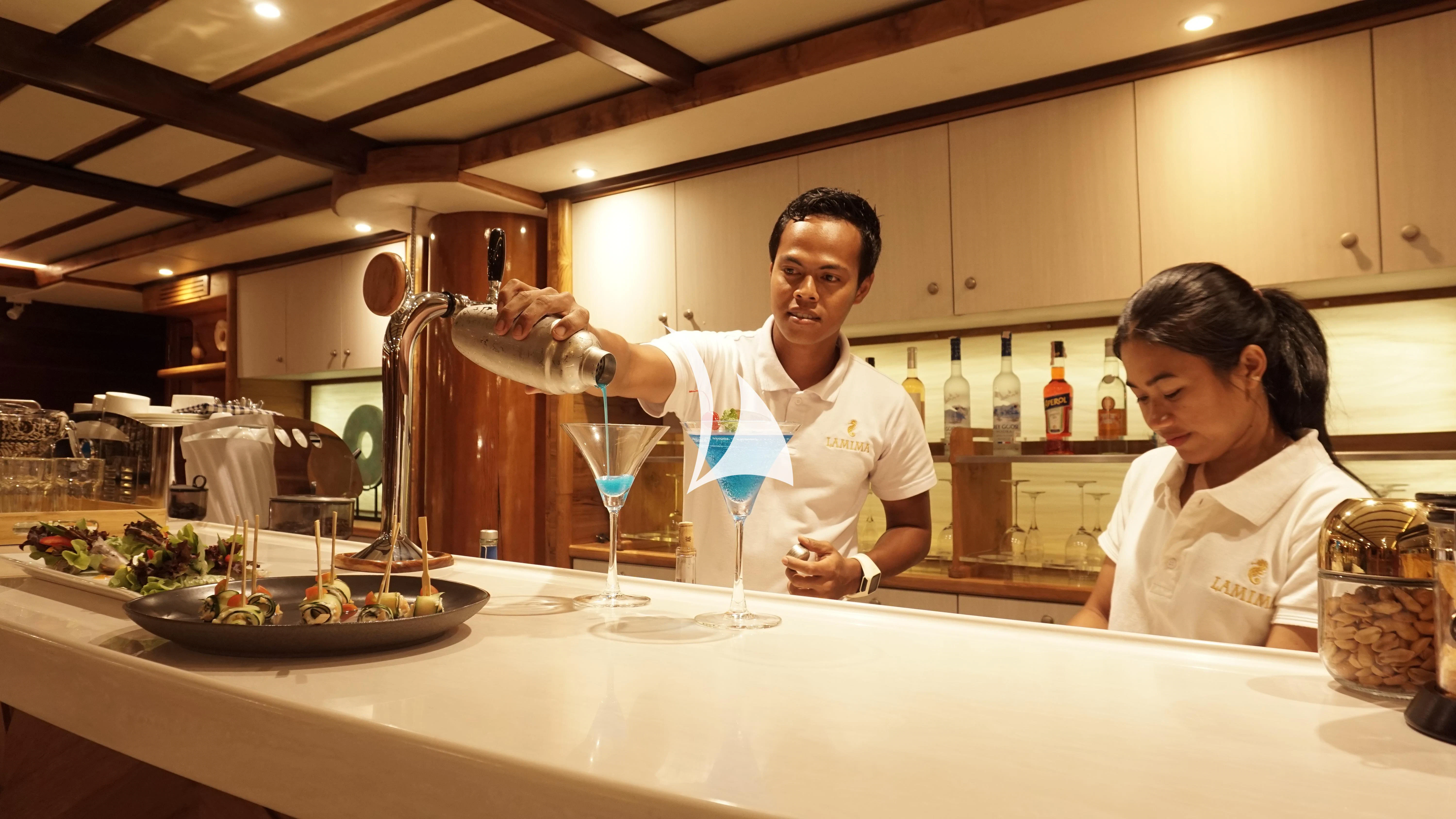 a couple of chef in a kitchen aboard LAMIMA Yacht for Sale