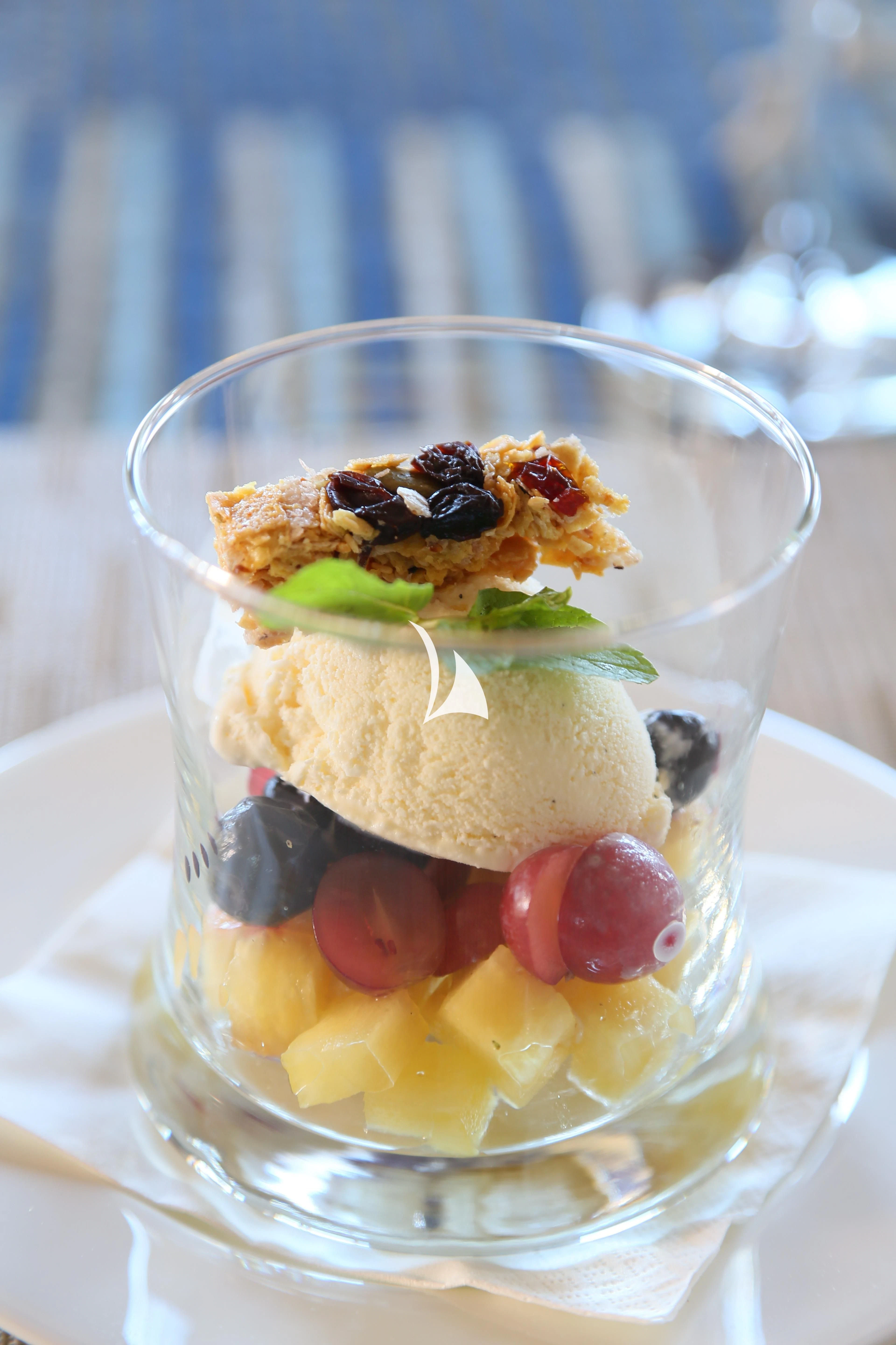 a glass of dessert with fruit aboard LAMIMA Yacht for Sale