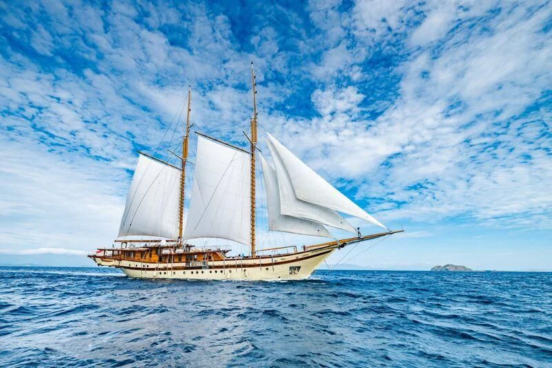 a large boat in the water aboard LAMIMA Yacht for Sale