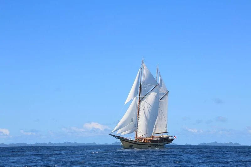 a sailboat in the water aboard LAMIMA Yacht for Sale