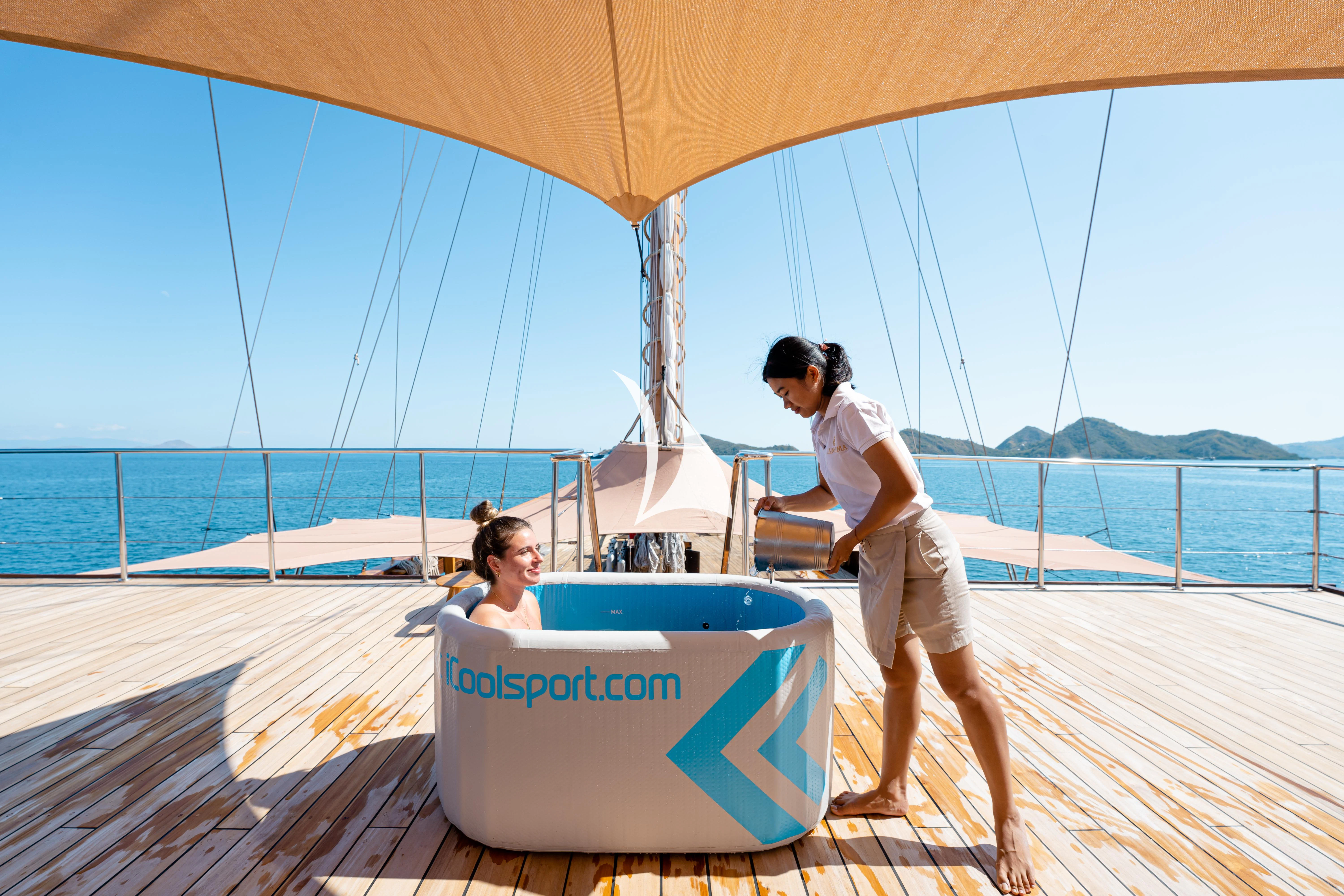 a man and woman on a boat aboard LAMIMA Yacht for Sale