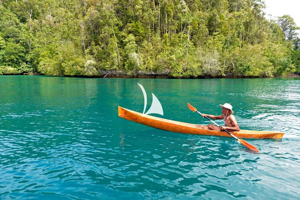 a man rowing a canoe aboard LAMIMA Yacht for Sale