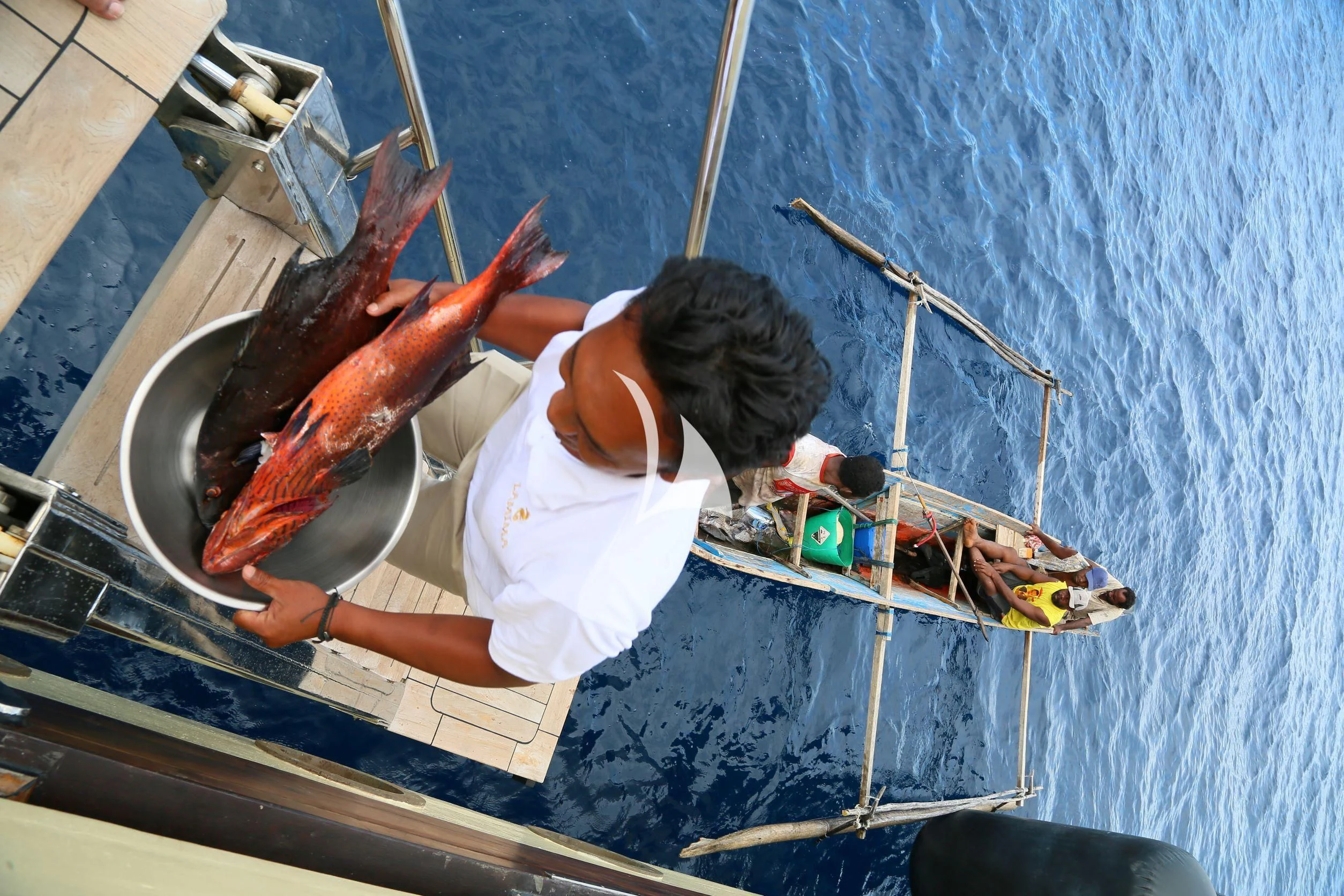 a person in a white shirt aboard LAMIMA Yacht for Sale