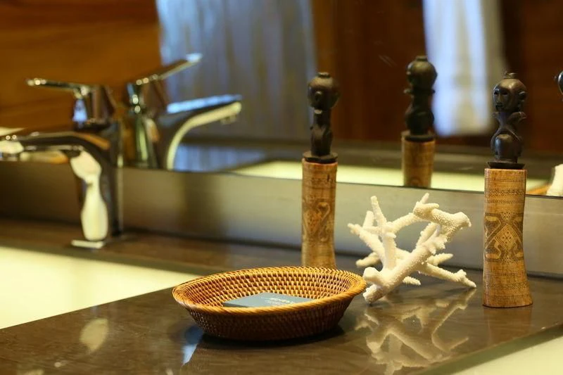 a wooden chess board with a few pieces aboard LAMIMA Yacht for Sale