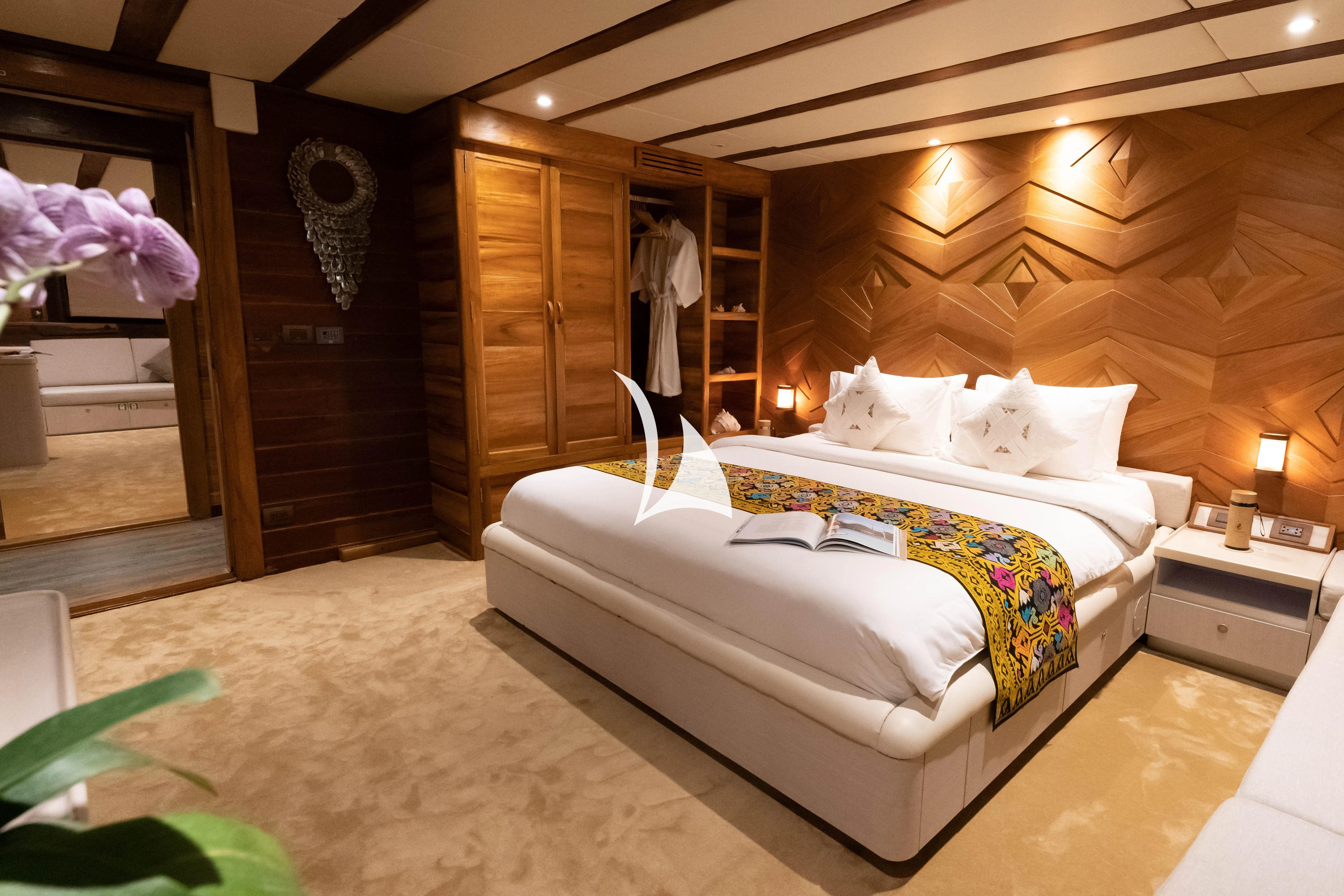 a bed in a room aboard LAMIMA Yacht for Sale
