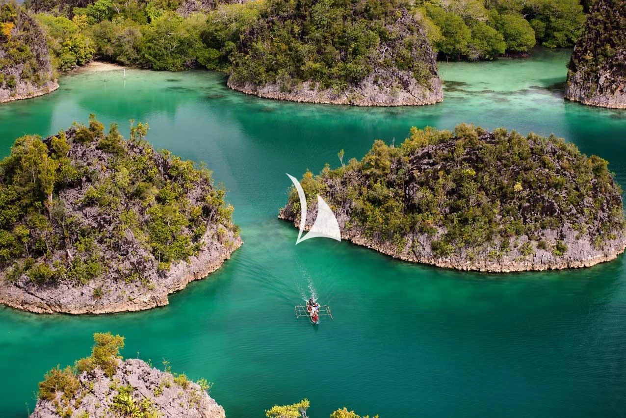 a boat sailing in the water aboard LAMIMA Yacht for Sale