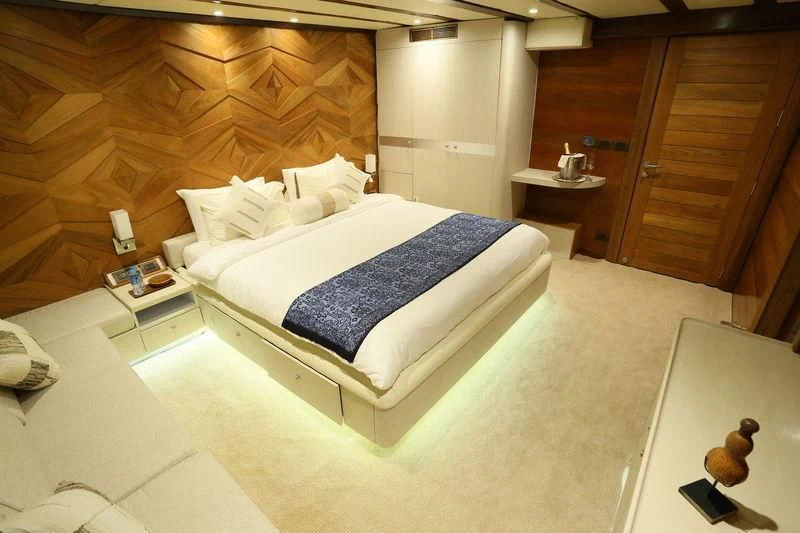 a bed in a room aboard LAMIMA Yacht for Sale