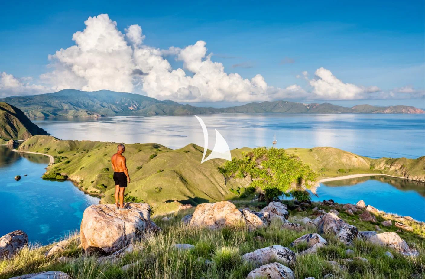a person standing on a rock aboard LAMIMA Yacht for Sale