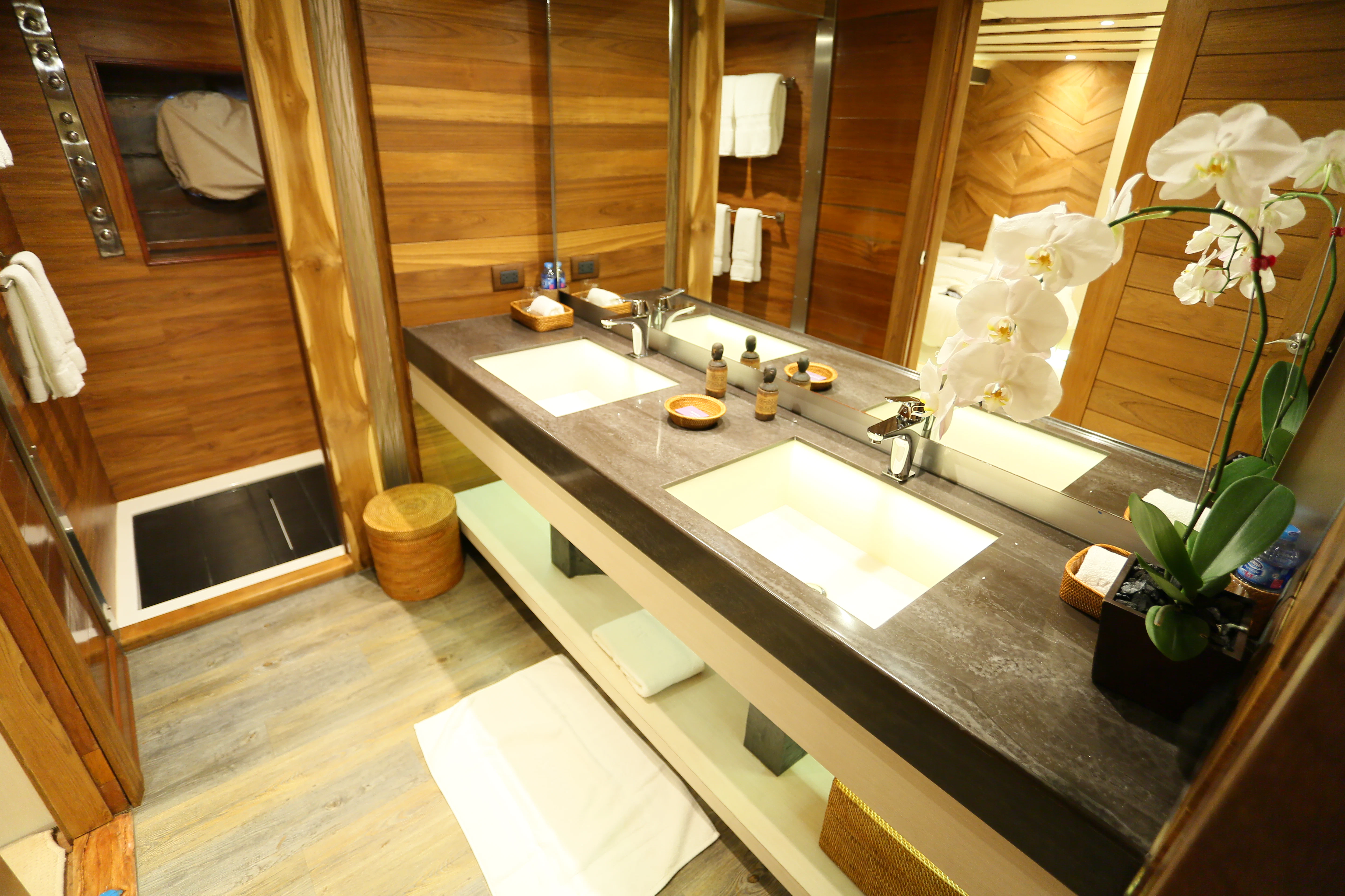 a bathroom with a large mirror aboard LAMIMA Yacht for Sale