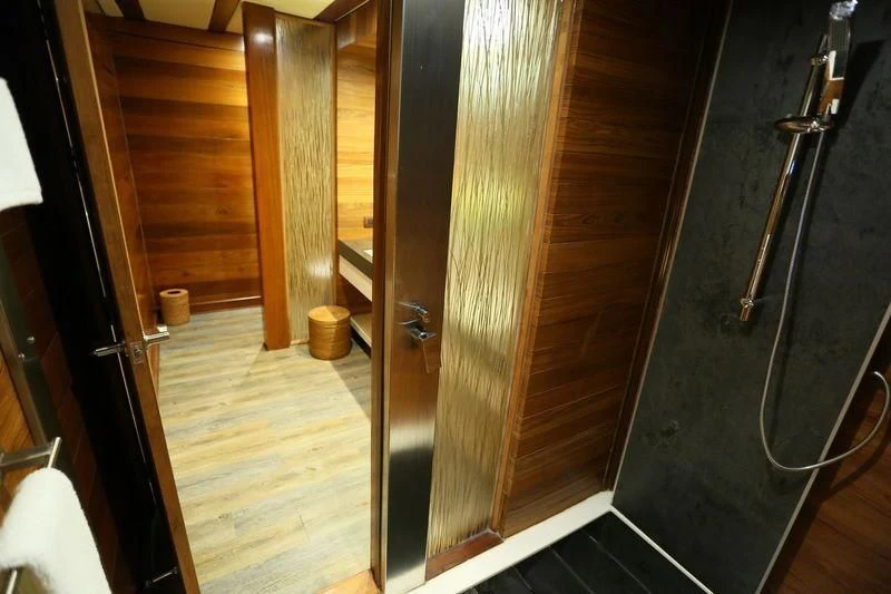 a hallway with wood doors aboard LAMIMA Yacht for Sale