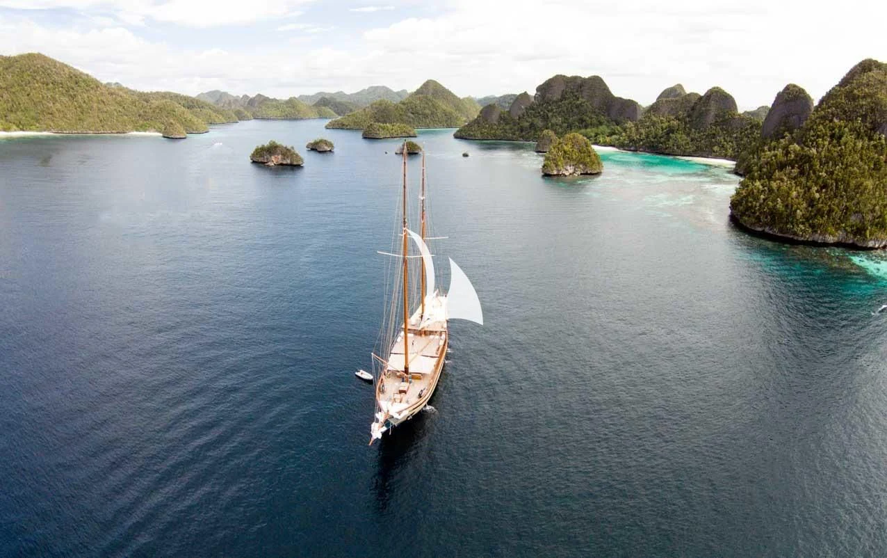 a boat sailing on the water aboard LAMIMA Yacht for Sale