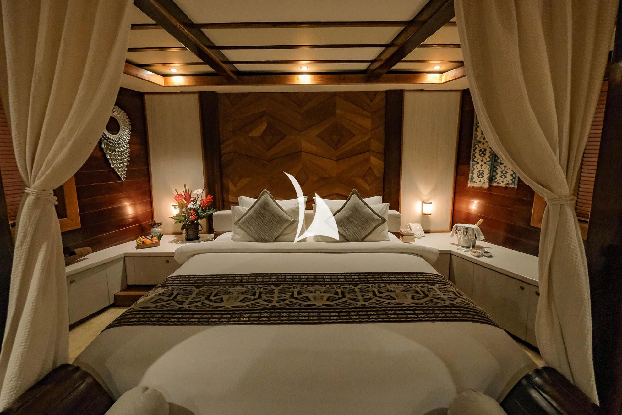 a bed with white sheets and pillows aboard LAMIMA Yacht for Sale