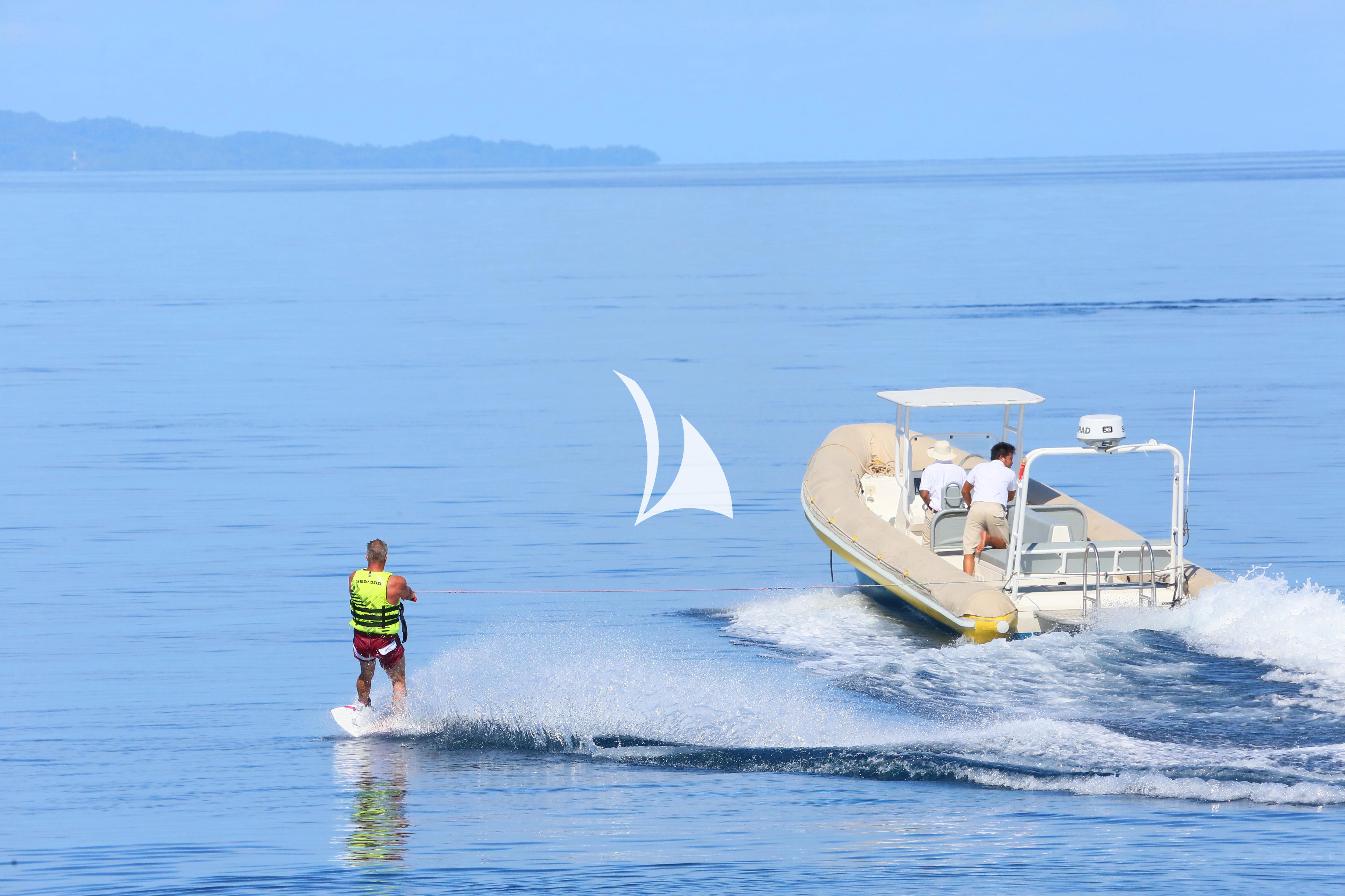 a person and a boy on a boat in the water aboard LAMIMA Yacht for Sale