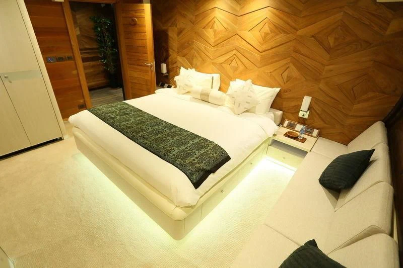 a bed in a room aboard LAMIMA Yacht for Sale