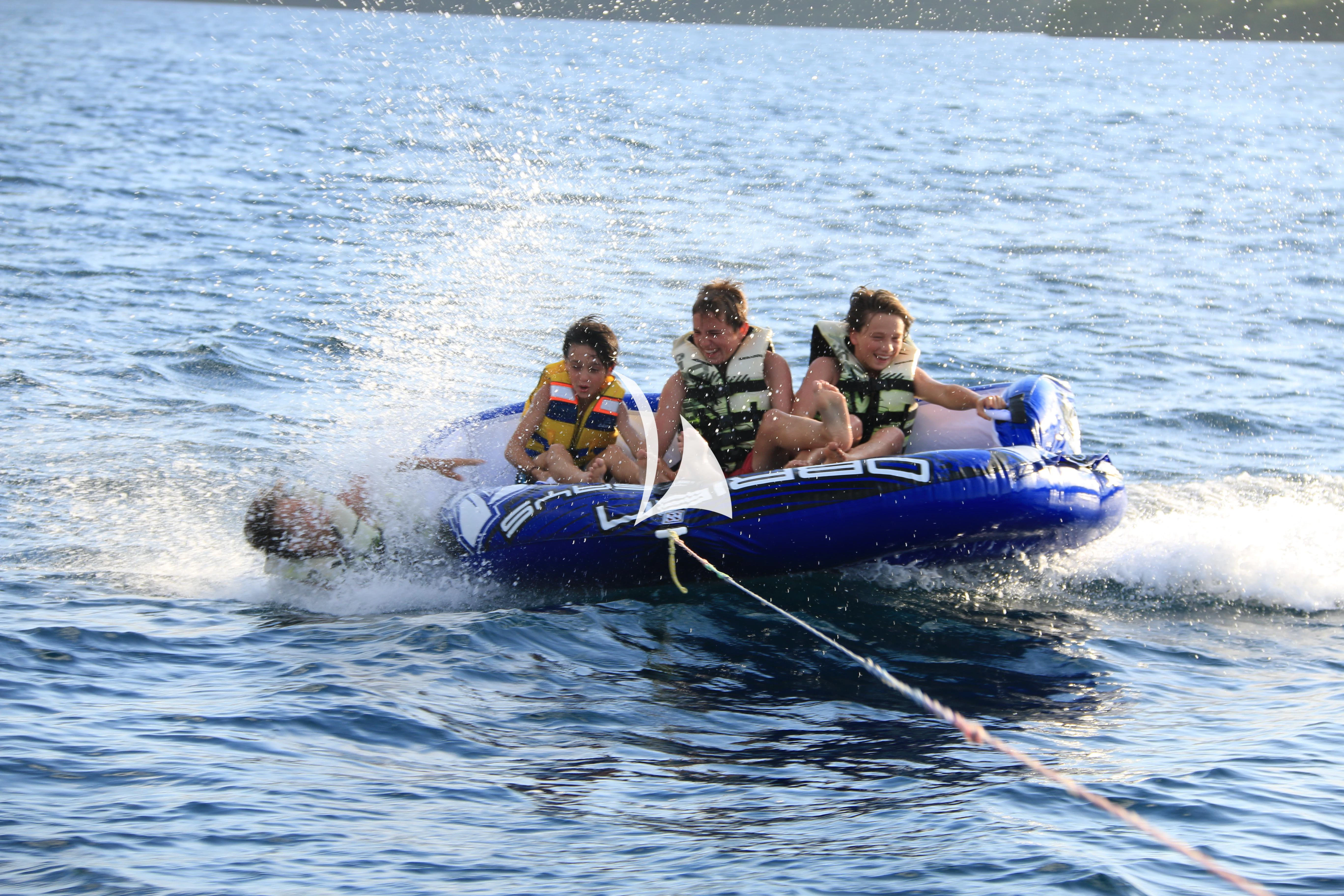 a group of people on a raft aboard LAMIMA Yacht for Sale