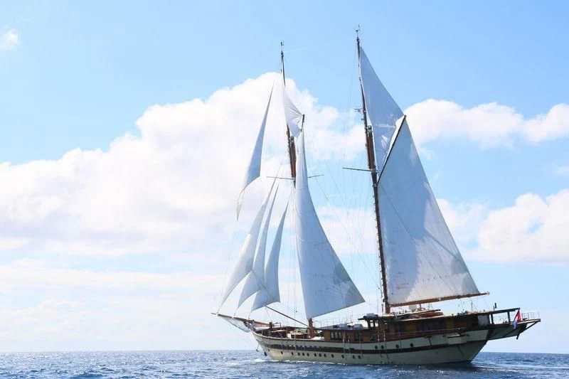 a sailboat in the water aboard LAMIMA Yacht for Sale