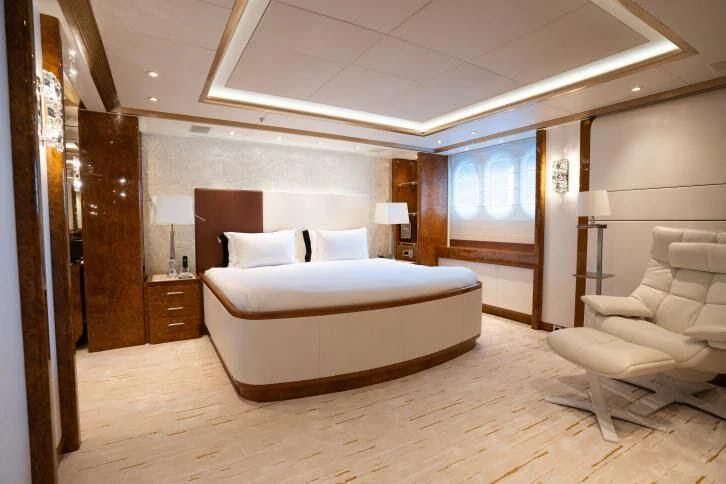a large bedroom with a bed aboard ALFA G Yacht for Sale