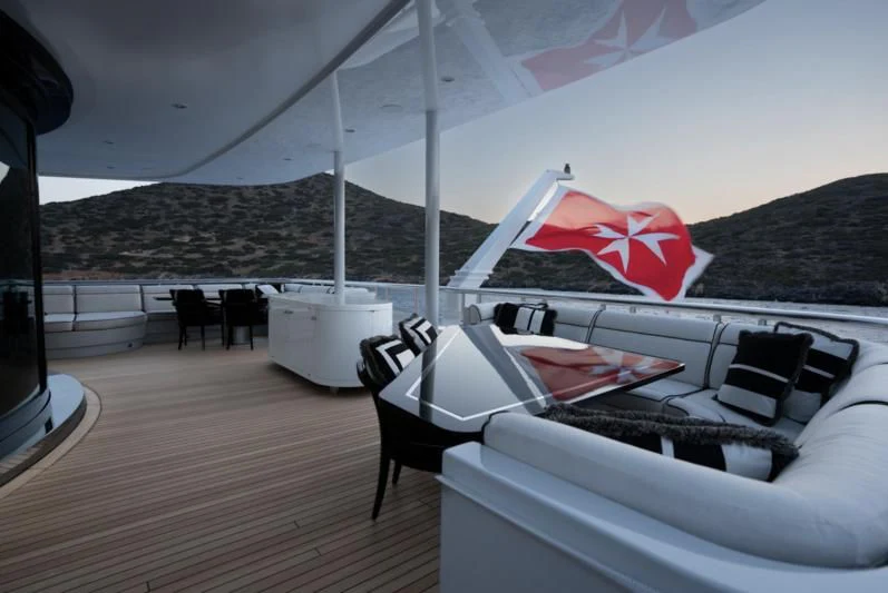 a tent with a red and white flag on it aboard ALFA G Yacht for Sale