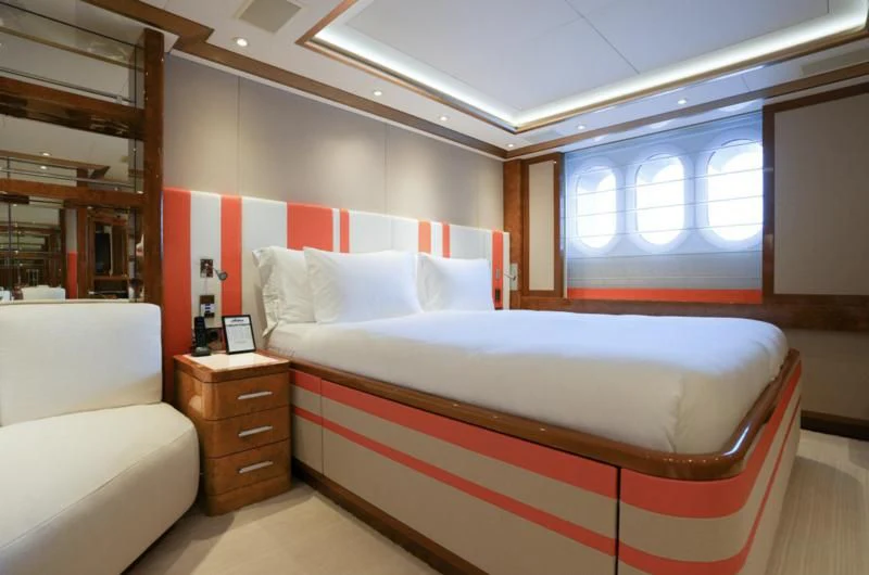 a room with a bed and a window aboard ALFA G Yacht for Sale