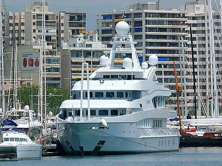 a large white boat in a harbor aboard ALFA G Yacht for Sale