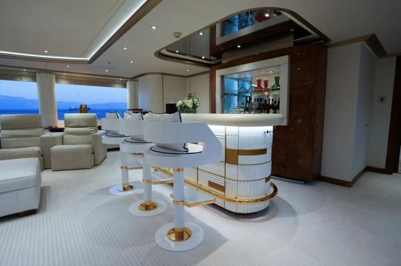 a room with a table and chairs aboard ALFA G Yacht for Sale