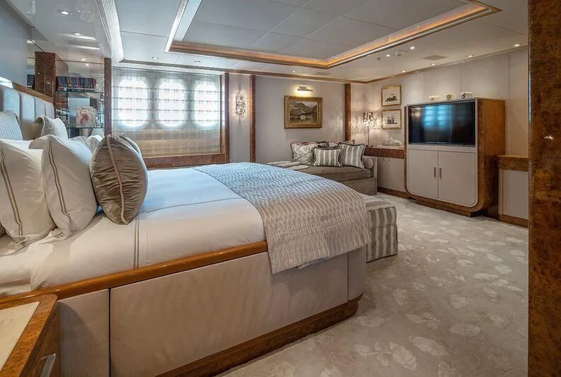 a bedroom with a large bed aboard ALFA G Yacht for Sale