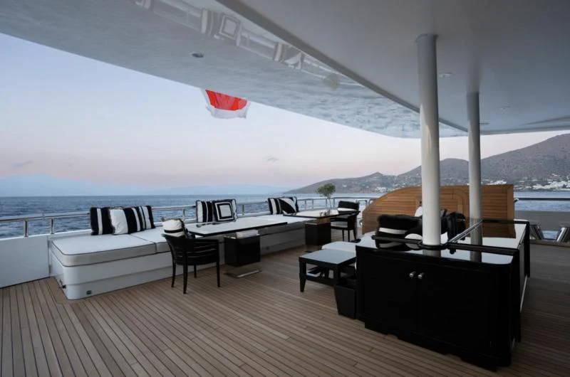 a deck with a large white boat and a large body of water aboard ALFA G Yacht for Sale