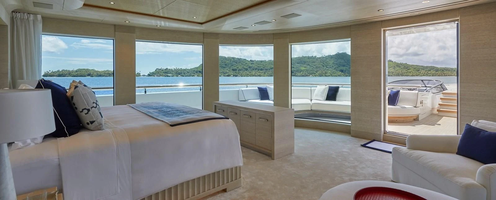 a room with a bed and a window aboard IJE Yacht for Sale