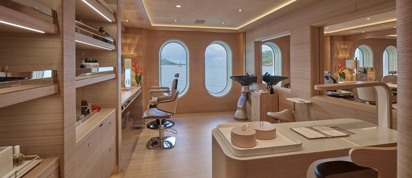 a room with a table and chairs aboard IJE Yacht for Sale