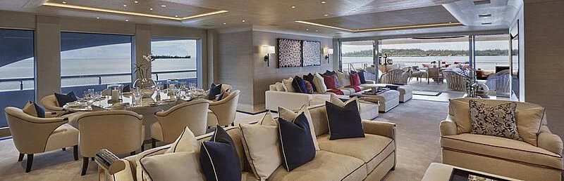 a large room with couches and a table aboard IJE Yacht for Sale