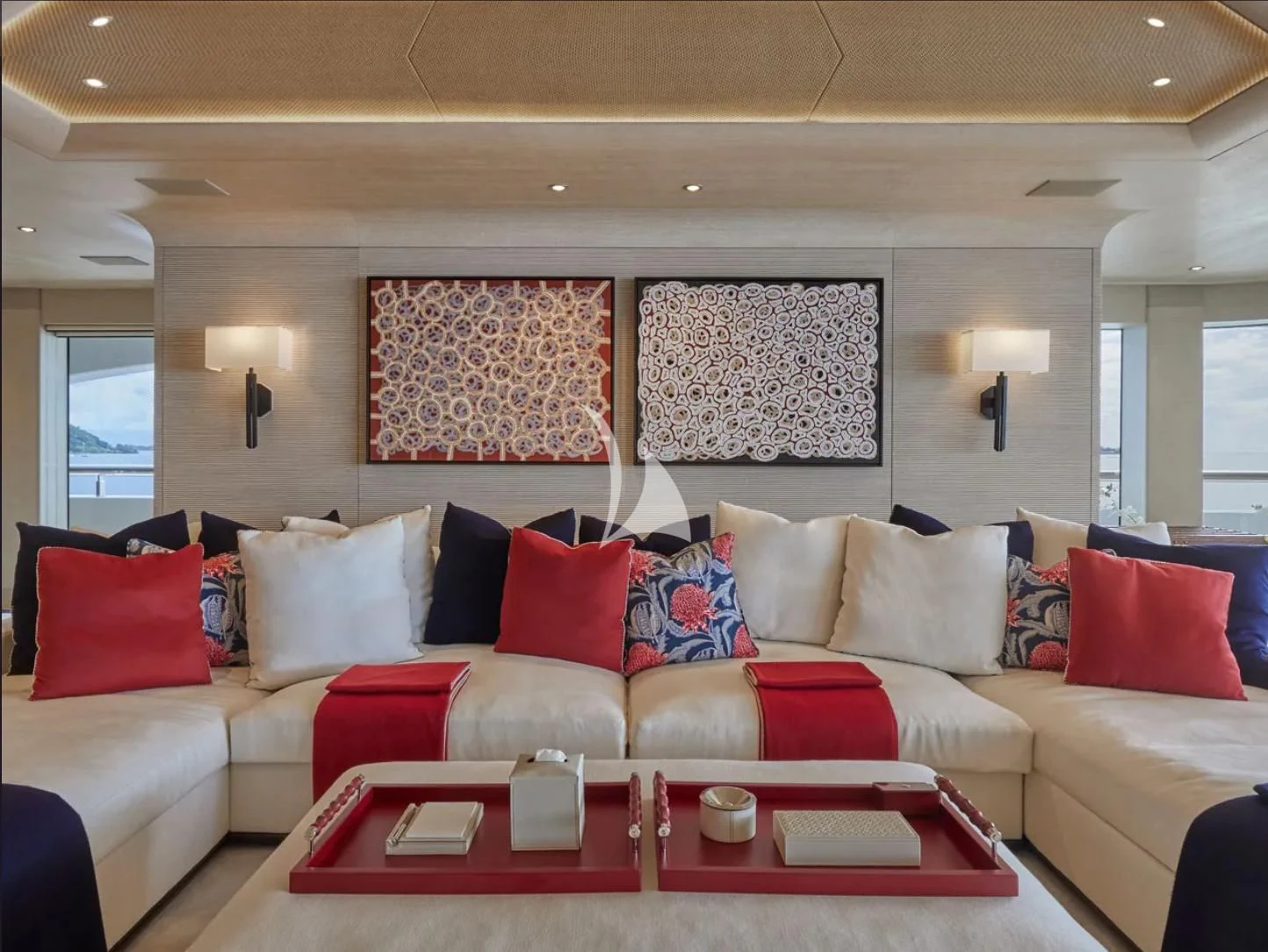 a living room with a couch and a table aboard IJE Yacht for Sale