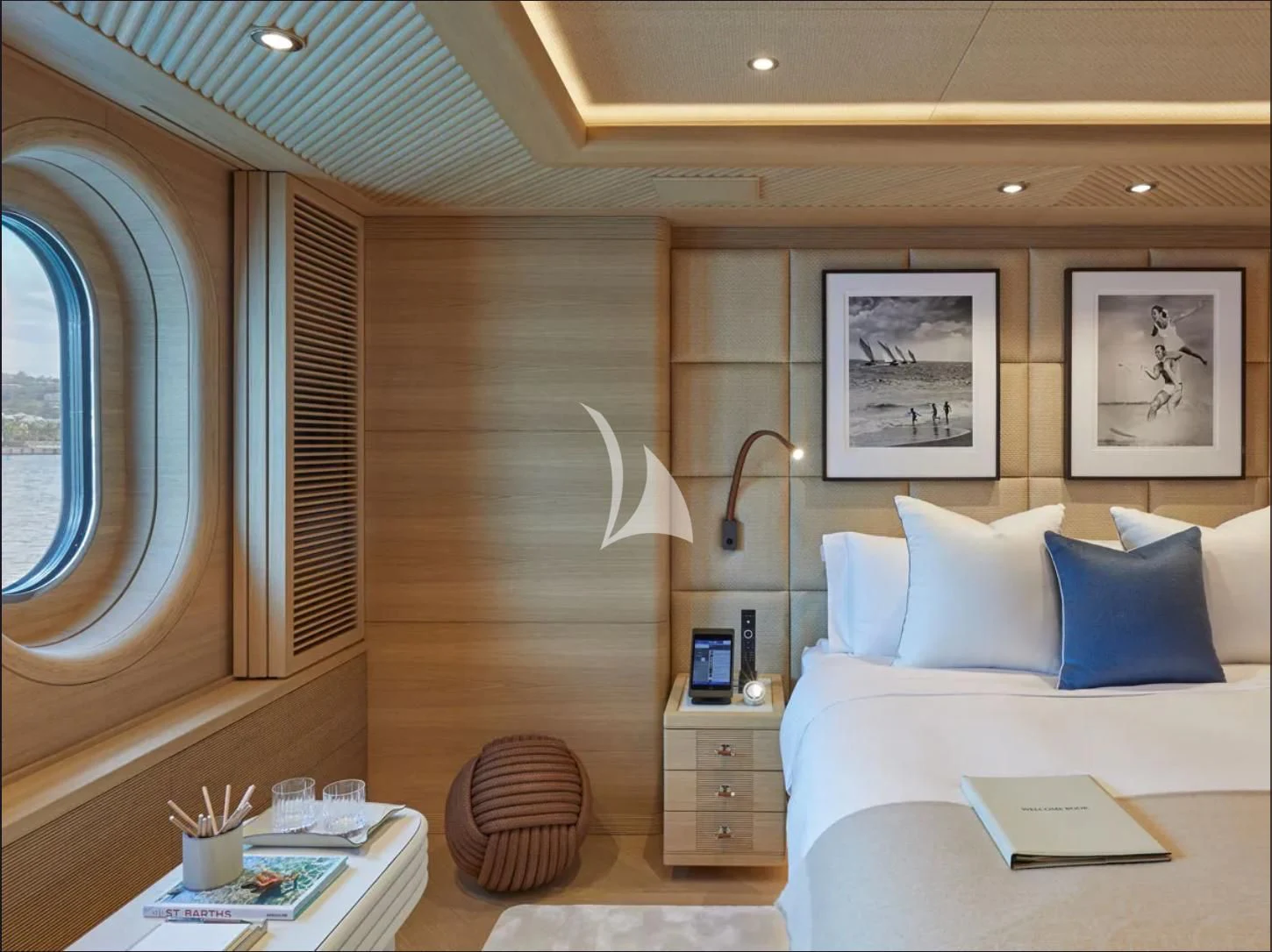 a room with a bed and a table aboard IJE Yacht for Sale