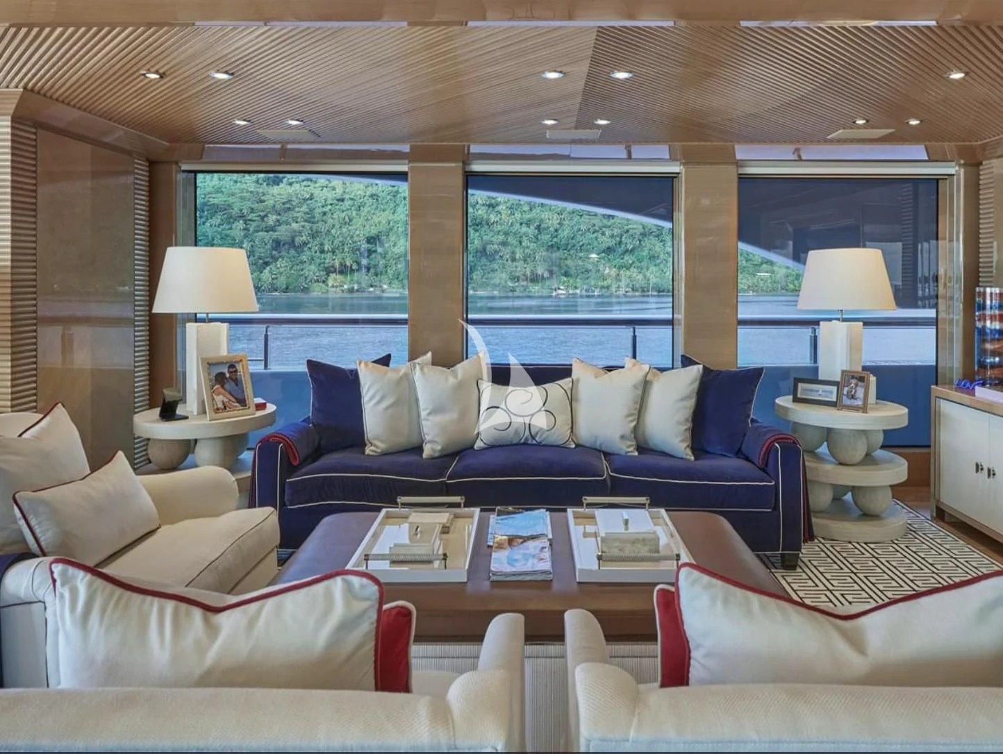a living room with a large window aboard IJE Yacht for Sale
