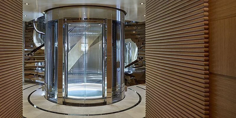 a large glass cabinet with a glass door aboard IJE Yacht for Sale