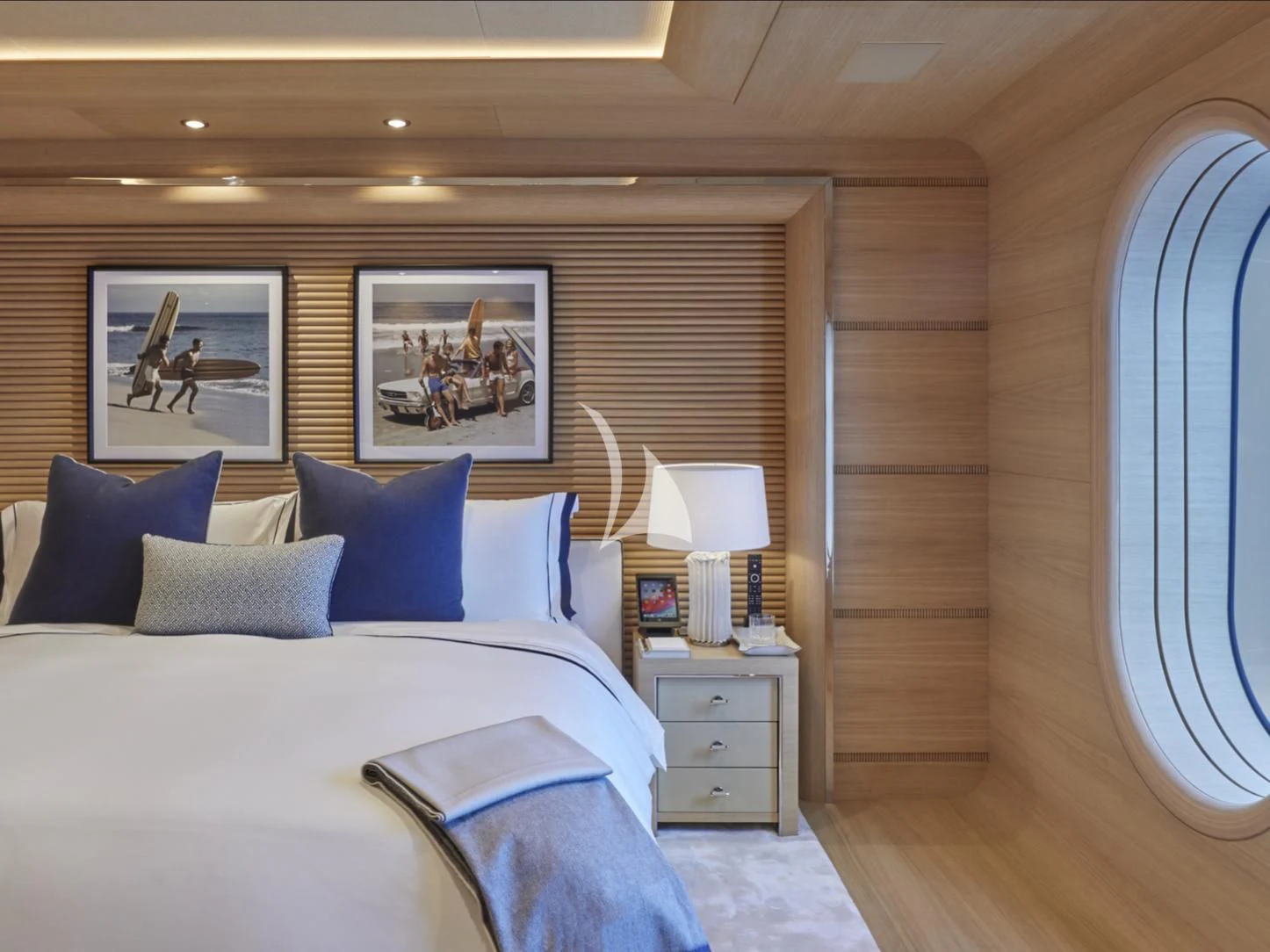 a bedroom with a bed and a window aboard IJE Yacht for Sale
