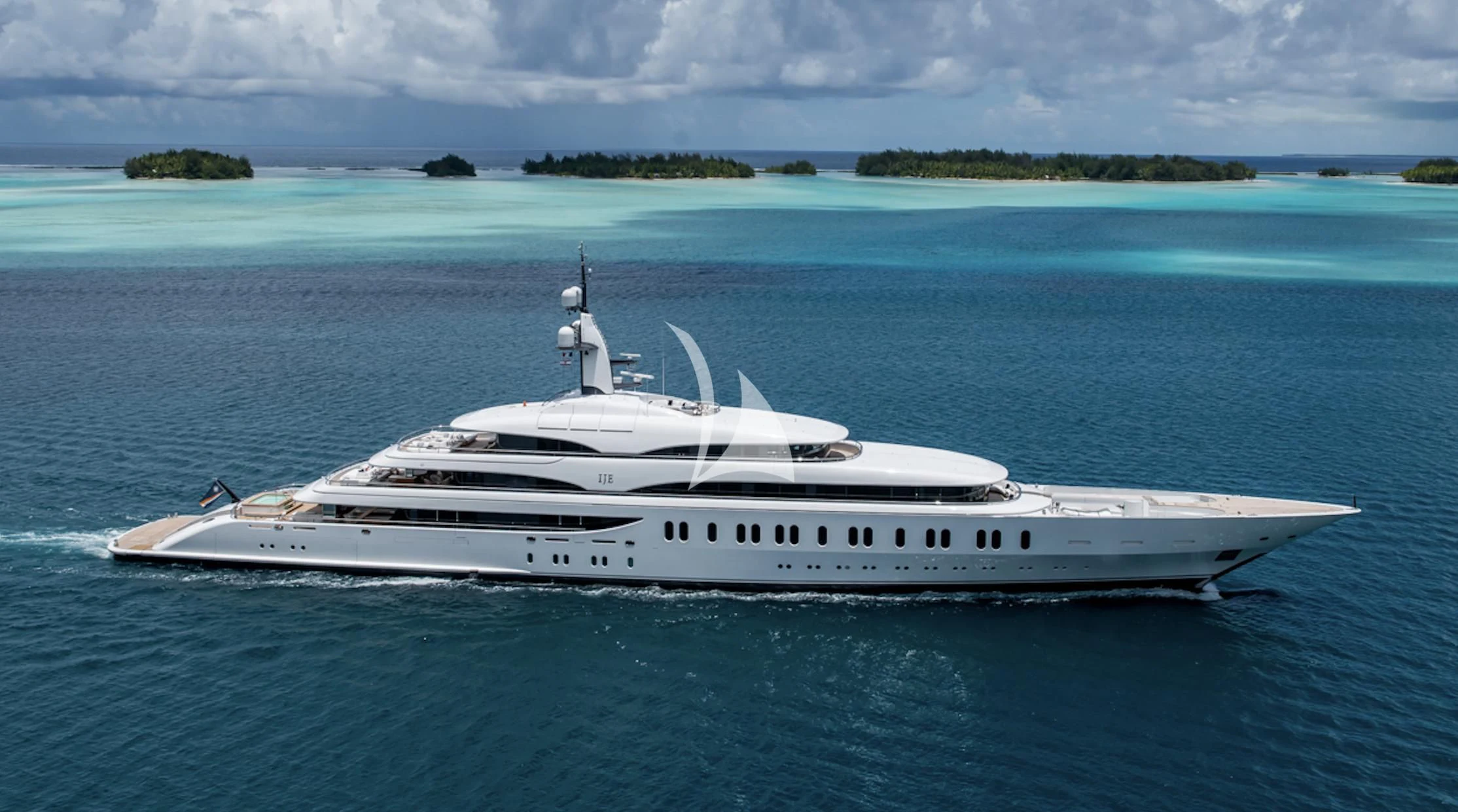 a white yacht in the water aboard IJE Yacht for Sale
