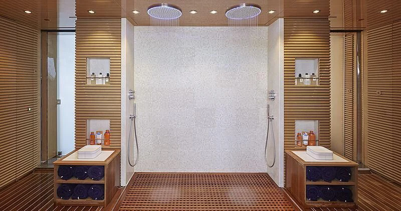 a room with a bed and a desk aboard IJE Yacht for Sale