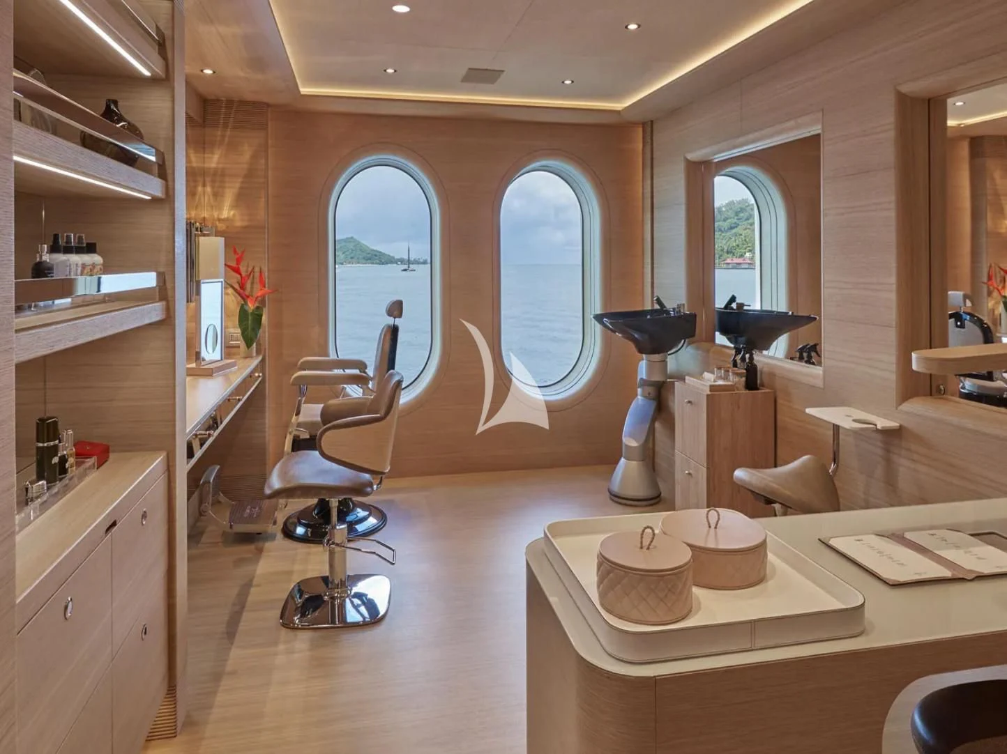 a room with a table and chairs aboard IJE Yacht for Sale