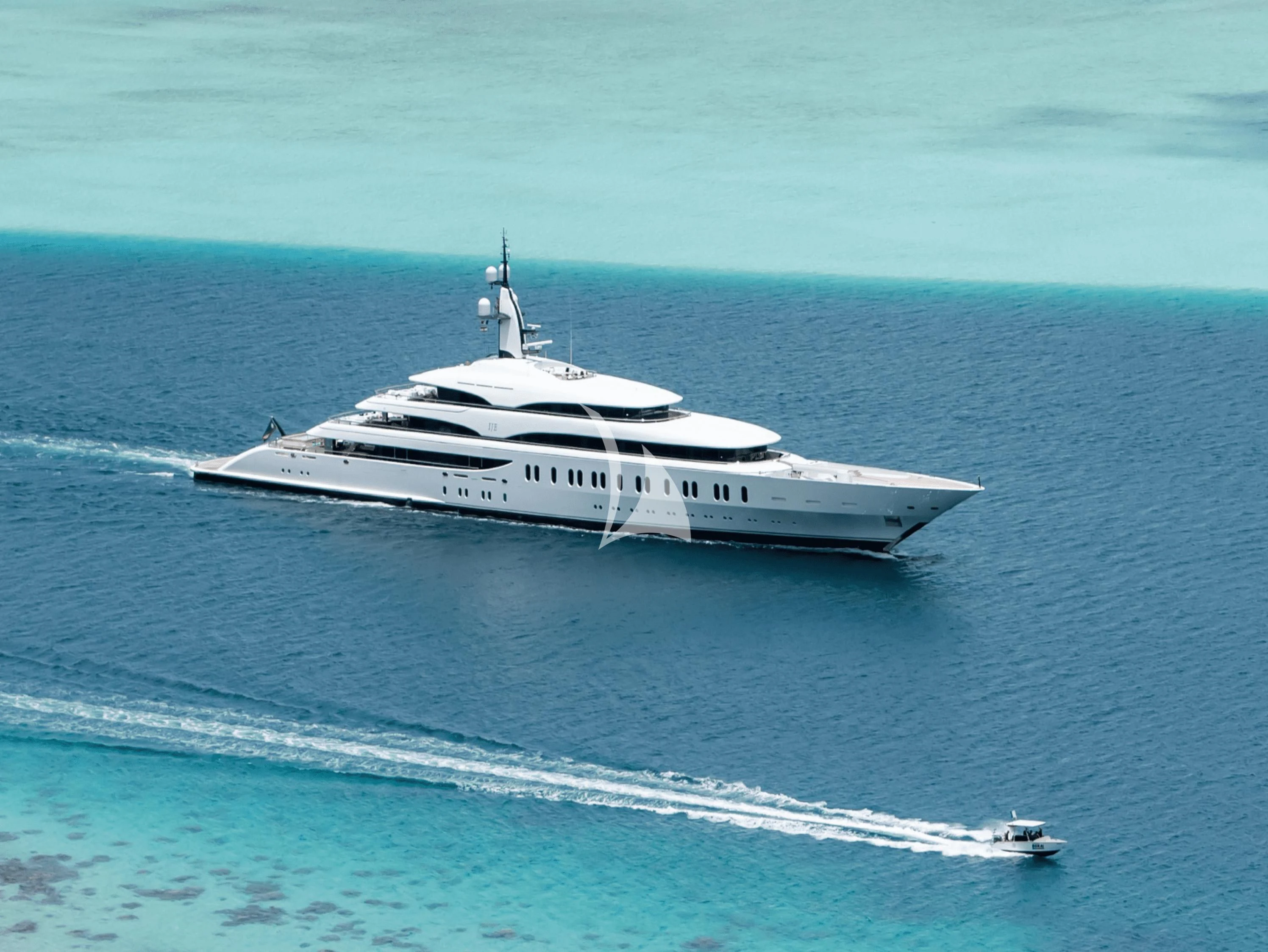 a white boat in the water aboard IJE Yacht for Sale