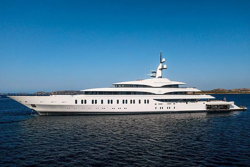 a large white yacht on the water aboard IJE Yacht for Sale