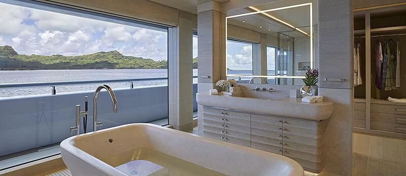 a large bathtub in a bathroom aboard IJE Yacht for Sale