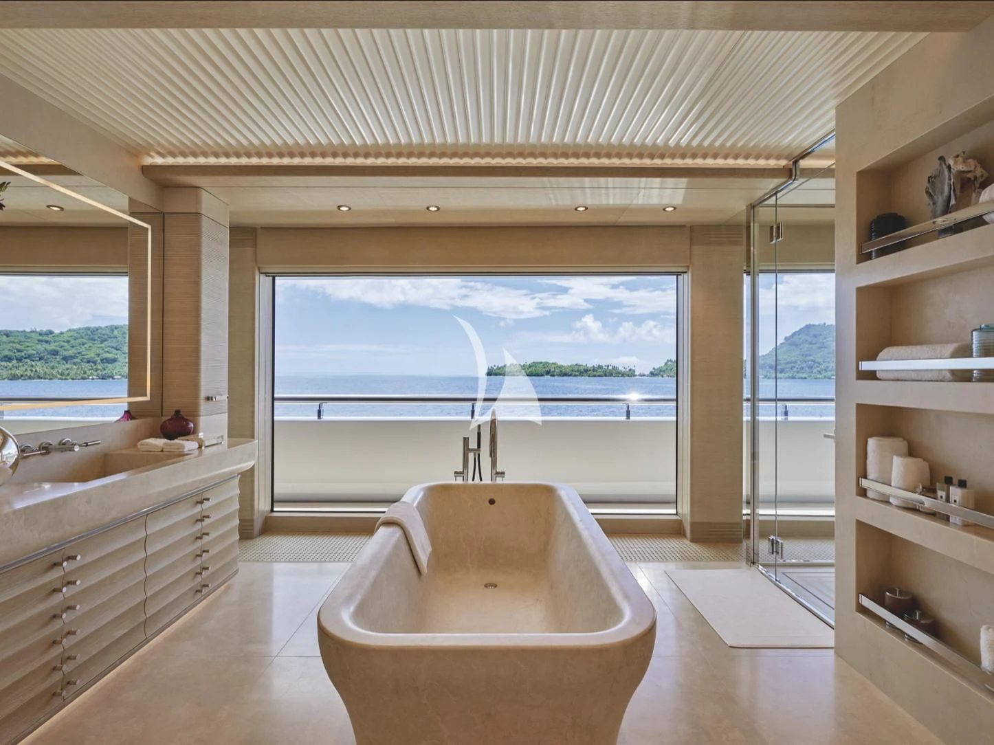 a bathroom with a tub and a window aboard IJE Yacht for Sale