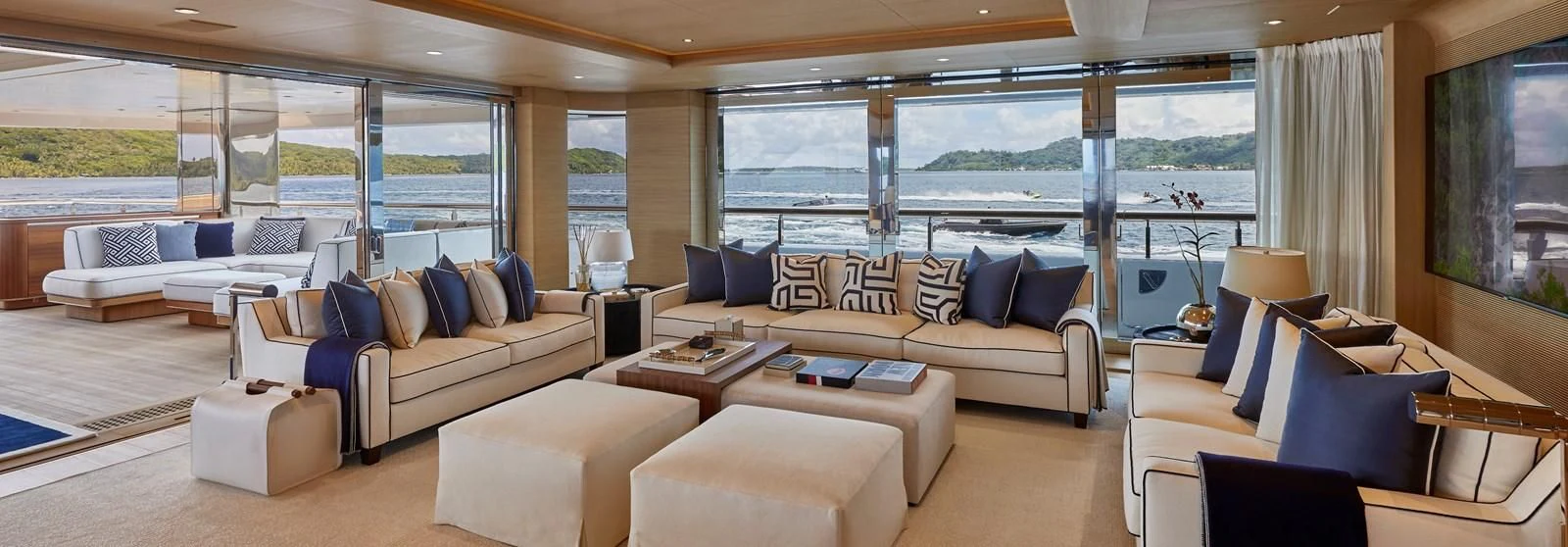 a living room with a large window aboard IJE Yacht for Sale