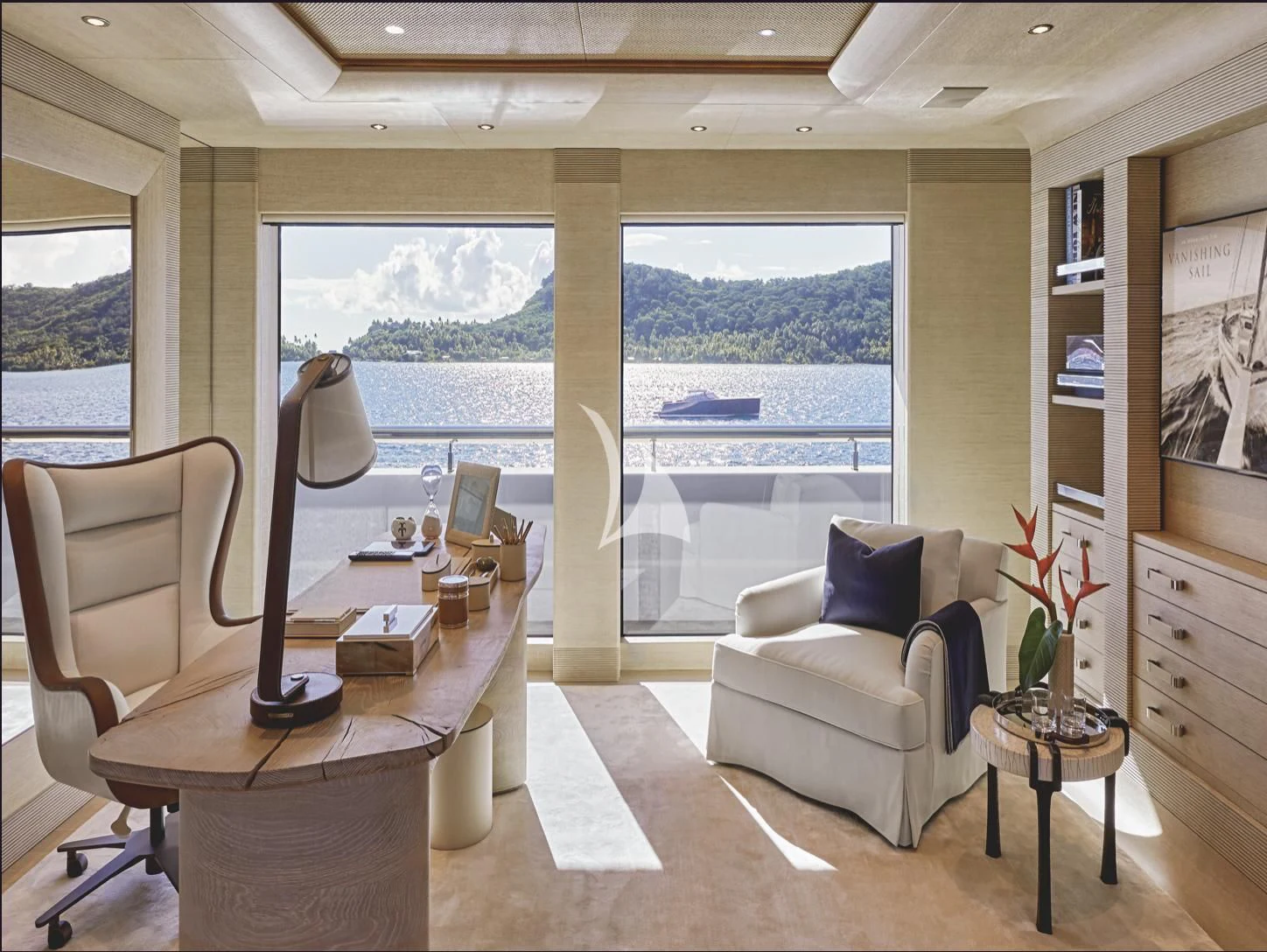 a living room with a large window aboard IJE Yacht for Sale